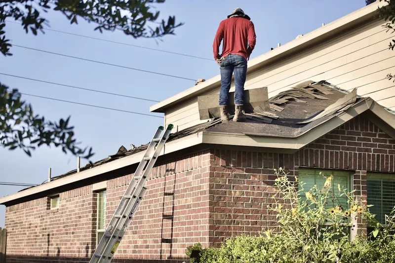 Professional roofer working on a residential roof in Los Cerritos